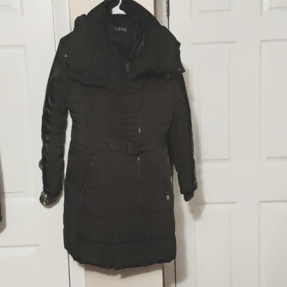 This is a women's black, thick, Guess coat
